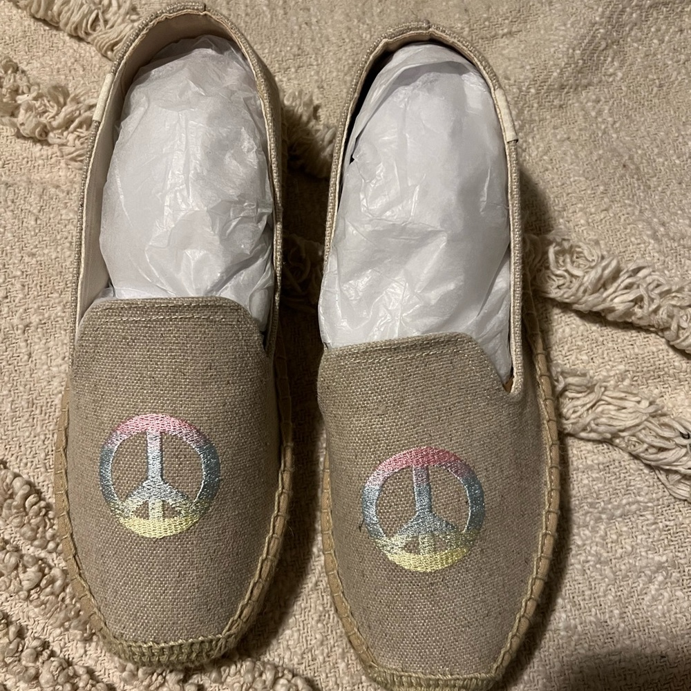 Never worn Soludos espradilles with peace sign